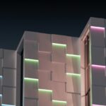Sleek, modern architectural model of a house is overlaid with glowing blue digital lines, symbolizing the integration of A...