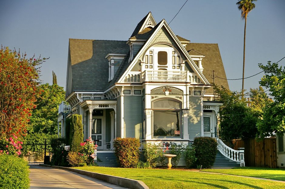 A welcoming and picturesque Southern-style home, typical of St. Tammany Parish, with a large front porch on a bright, sunny day.